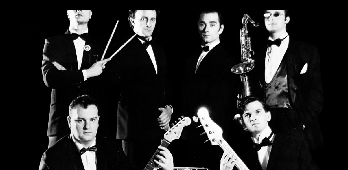 I Vindicators in smoking: i musicisti nella parte alta della copertina di That's All Rock, 1987